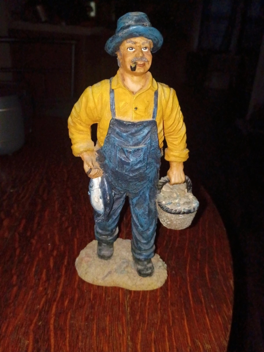 Hand-Painted Fisherman Figurine in Blue and Yellow